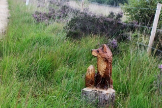 A wooden statue of a fox that was stolen from Little Woolden Moss in Manchester