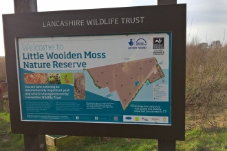 An information board at Lancashire Wildlife Trust's Little Woolden Moss nature reserve