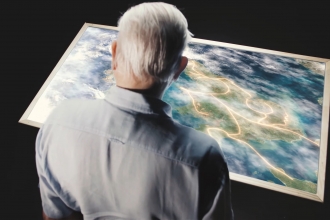 David Attenborough looks at a map of how Nature Recovery Networks will work