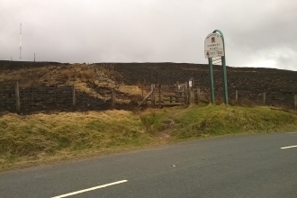 Scorched areas of Darwen Moor seen from the road after a fire