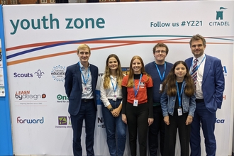Members of the Lancashire Wildlife Trust Youth Council standing in front of a sign that says 'Youth Zone' with Wildlife Trusts CEO Craig Bennett