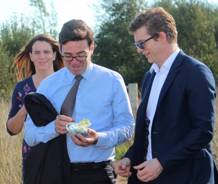 Andy Burnham and Chris Casey squeezing sphagnum moss on Little Woolden Moss