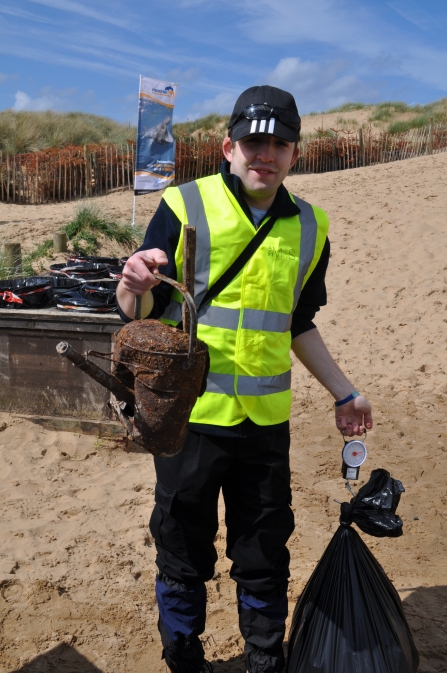 Our volunteer Andy Laverick cleaning up litter on Formby beach