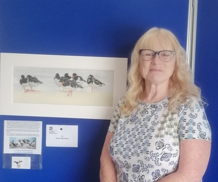 Artist, Karen Markham, and her winning entry for the 'coastal wildlife' category 