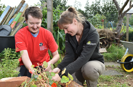 Jamie and Nature and Wellbeing Officer Jo collecting some seeds