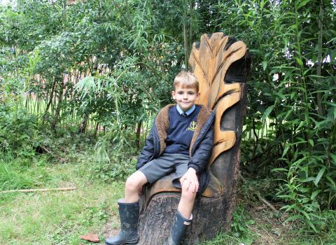 little boy at Freckleton on carved chair
