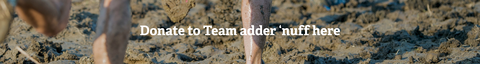 A photos of people running in deep mud with 'Donate to Team Adder 'nuff here' in text