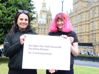 Abbie & Izzy holding a HS2 petition for Downing Street