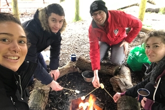 Warming up round the fire at Bolton