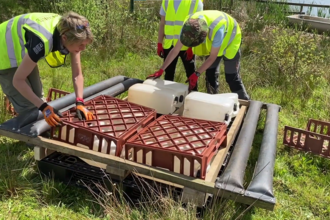 Tom, Lorna and their team of young conservation interns building new tern rafts using recycled and reused materials including empty water containers and bread bins.