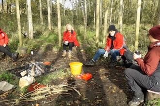 Four participants sat having a discussion as part in a MyPlace session at Brockholes Nature Reserve