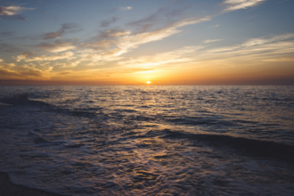sun setting over the sea