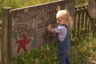 Toddler playing at The Hive