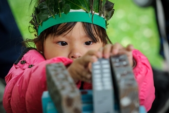 child playing games at MFON 