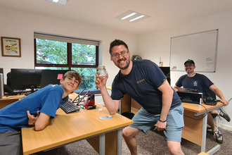 Lewis (left) posting with a staff member at Brockholes