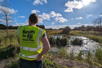 Forestry Commission volunteer looking out over Barlow’s Wood in Bickershaw, Wigan