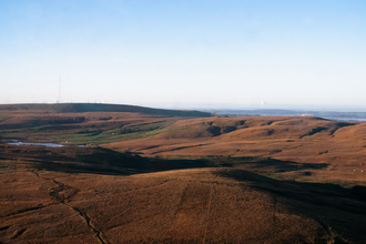 A beautiful moorland with small bodies of water and a blue sky