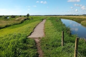 a spillway at Lunt Meadows next to the river Alt in sunny weather