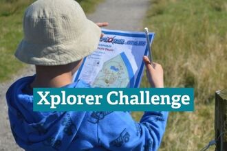 Child looking at Xplorer Challenge Map