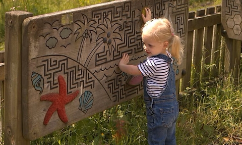 Child playing at the Hive