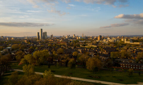 The Manchester Skyline with a park in the foreground by Nick Rodd