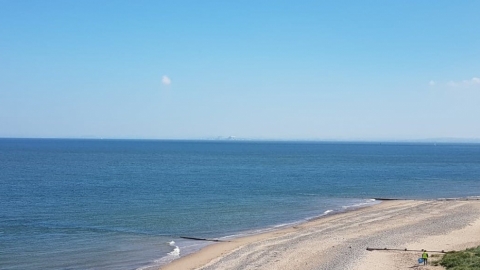 Beach, sea and bright blue sky on the Wyre coast