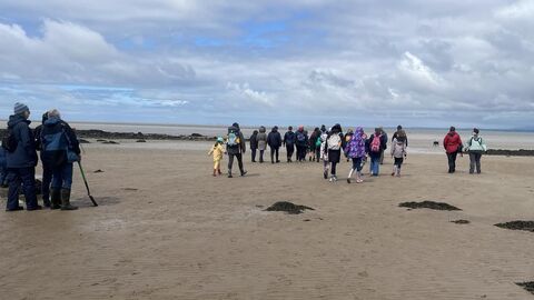 People walking on Morecambe Bay