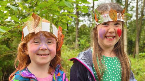 Children wearing nature crowns