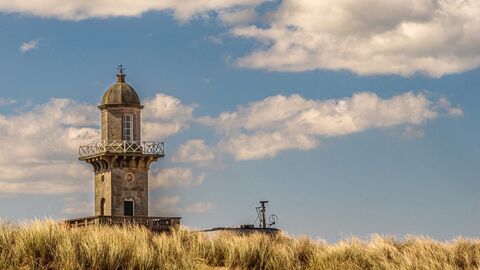 Lower lighthouse in Fleetwood seen above the sand dunes