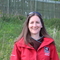 A smiling woman with brown hair