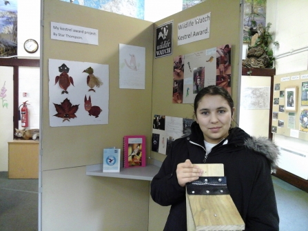 Star holding up the bird box she made as part of her Kestrel Award