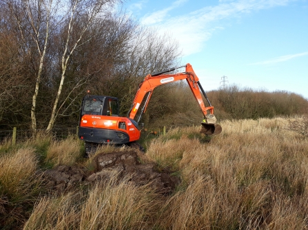Digger arriving to start bunding work at Heysham Moss nature reserve