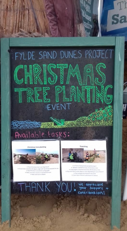 A welcome board for volunteers at the 2019 Christmas tree planting event