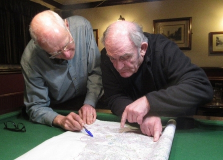 Mike Fisher of the GPAG looking over documents with a colleague