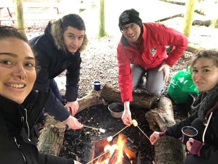 Warming up round the fire at Bolton