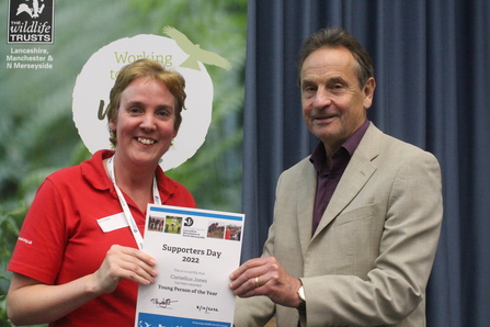 Catherine Haddon accepting the young person of the year award on behalf of Cornelius Jones at the Supporters Day 2022