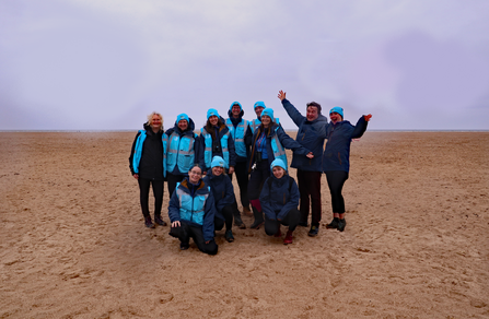 A photo of a group of people on a beach