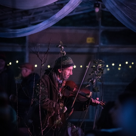 A man playing a fiddle