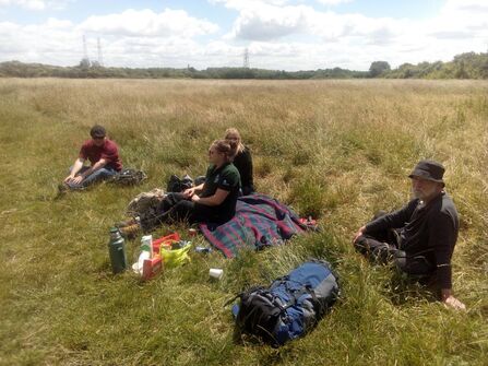 People having a picnic in a field