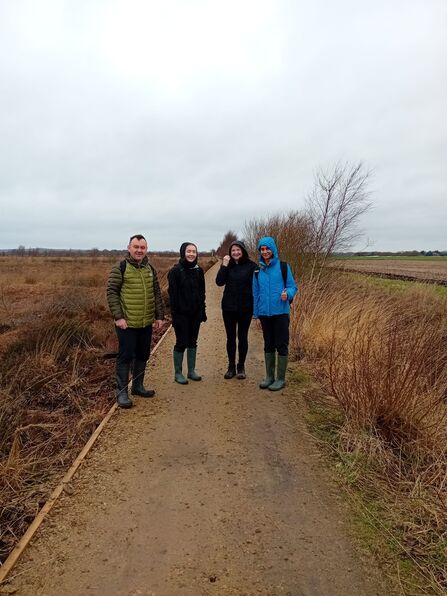 4 people stood on a reserve path