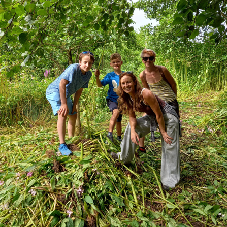 Group with balsam pile