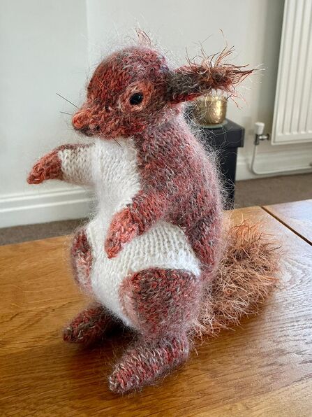 A knitted red squirrel sold on Etsy by volunteer Lynn