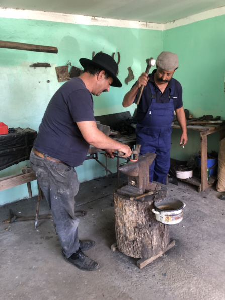 Blacksmiths from the local Gypsy community hard at work in Romania.