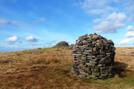 A photo of two stone cairns