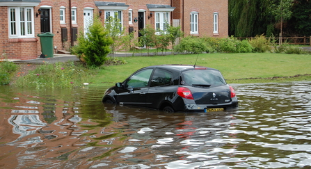 Black car under flood water