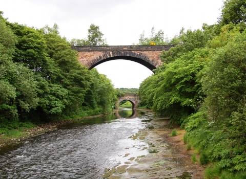 Bridges across a river at Philips Park on the Kingfisher Trail