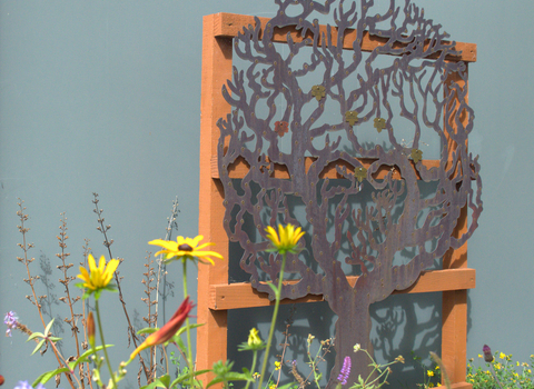 Mere Sands Wood Memory Tree with flowers in the foreground